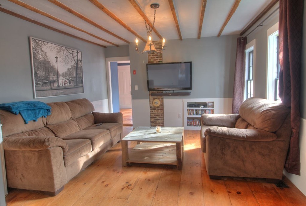 157 Fitchburg Road Townsend, MA 01469 - Photo 6 of 17 a living room with furniture and a flat screen tv