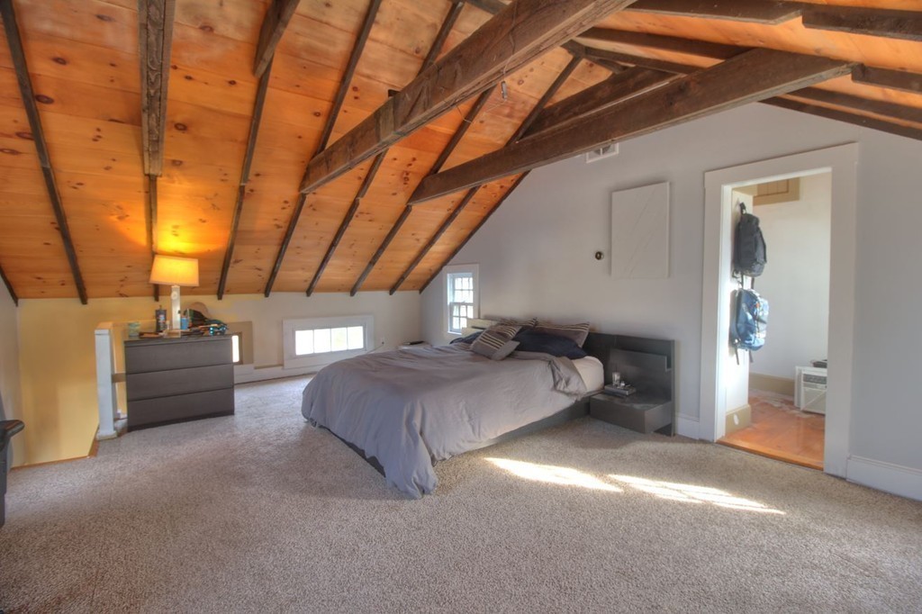 157 Fitchburg Road Townsend, MA 01469 - Photo 9 of 17 a spacious bedroom with a bed and a chandelier
