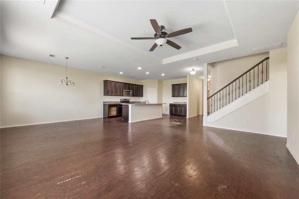 2239 Heaton Street Forney, TX 75126 - Photo 13 of 25 a view of a kitchen with a sink stove wooden floor and a kitchen view