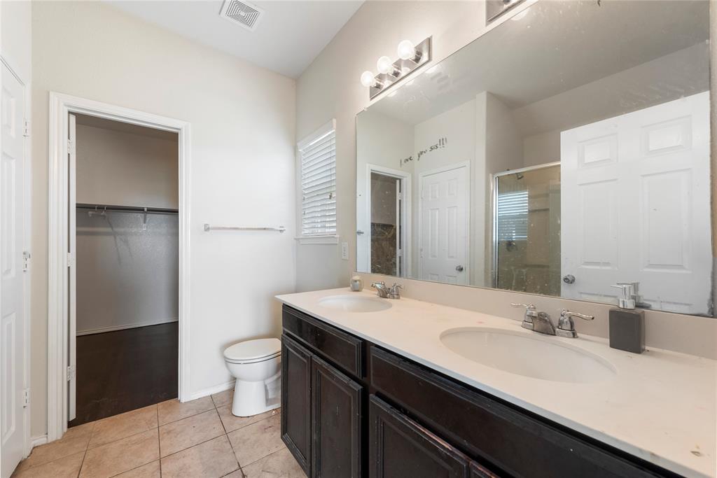 2239 Heaton Street Forney, TX 75126 - Photo 16 of 25 a bathroom with a sink double vanity and a mirror