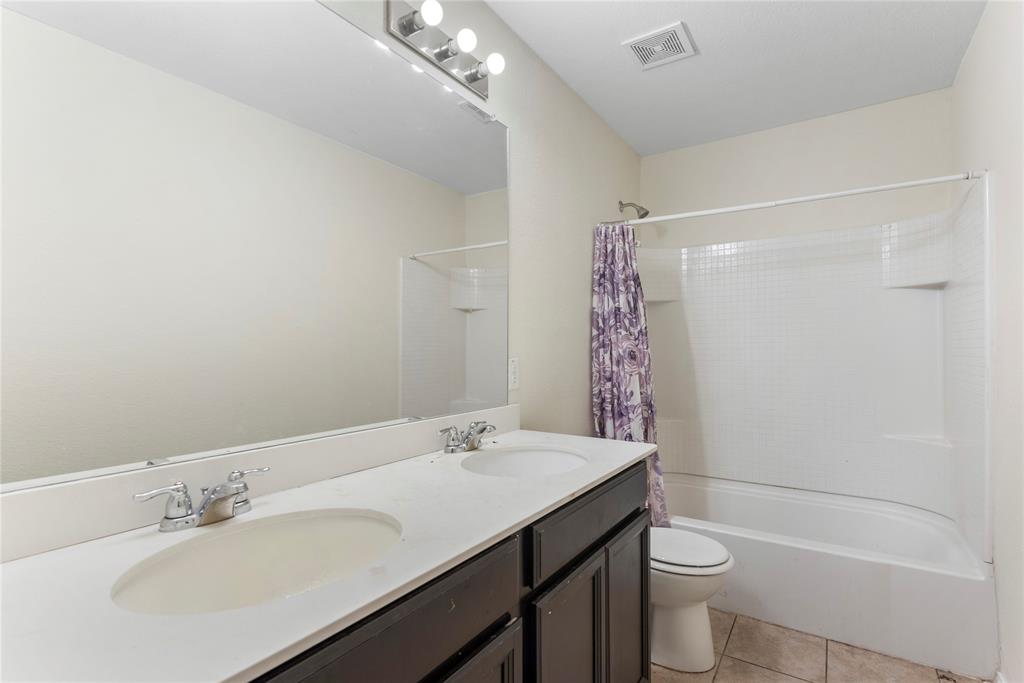 2239 Heaton Street Forney, TX 75126 - Photo 21 of 25 a bathroom with a sink toilet and shower