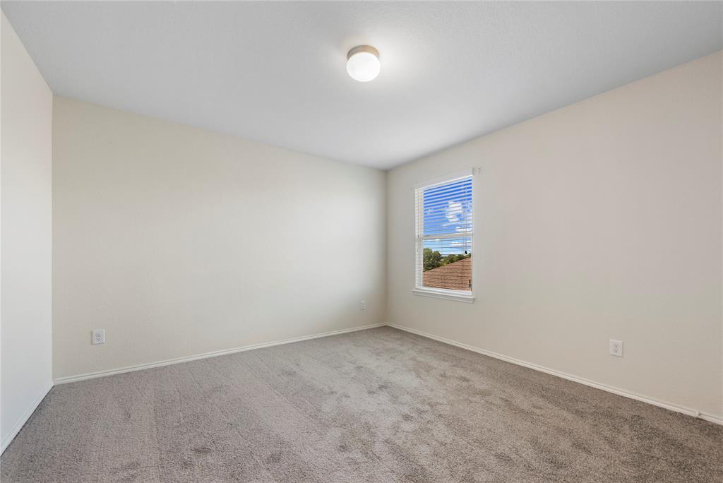 2239 Heaton Street Forney, TX 75126 - Photo 22 of 25 an empty room with a window