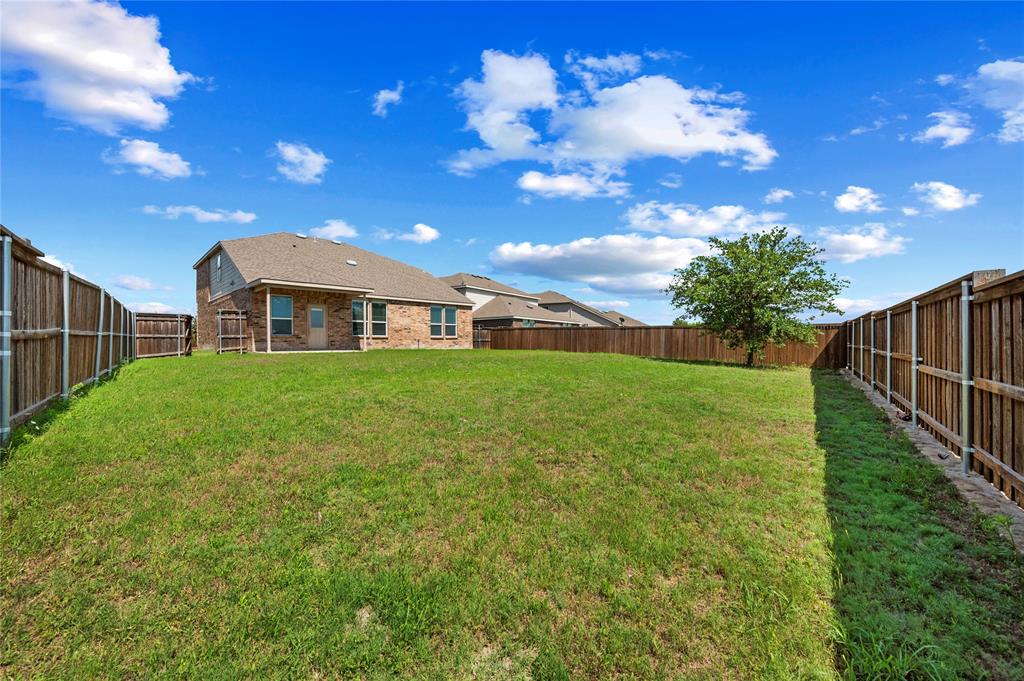 2239 Heaton Street Forney, TX 75126 - Photo 25 of 25 a view of a house with backyard and sitting area