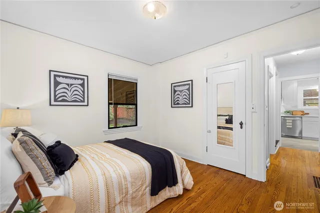 a bedroom with a bed and the view of bathroom