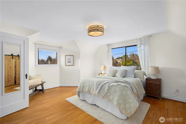 a bedroom with a bed and a couch