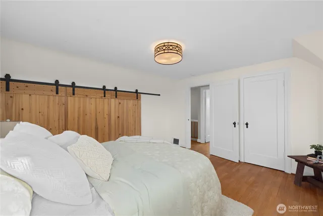 a bedroom with a bed and a table