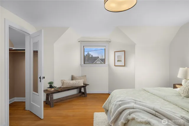 a bedroom with a bed and a couch