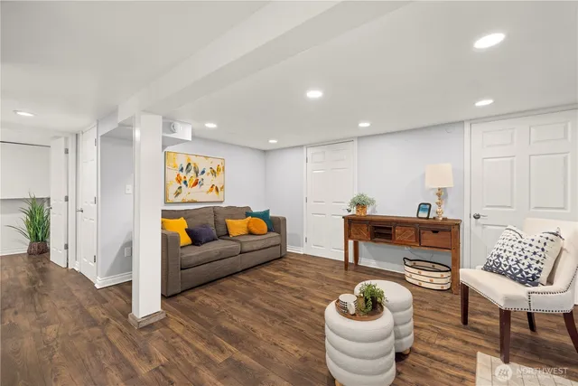 a living room with furniture and a potted plant