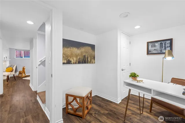 a workspace with furniture and wooden floor