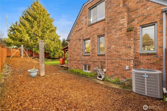 a view of a brick house with many windows