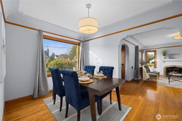 a view of a dining room with furniture window and wooden floor