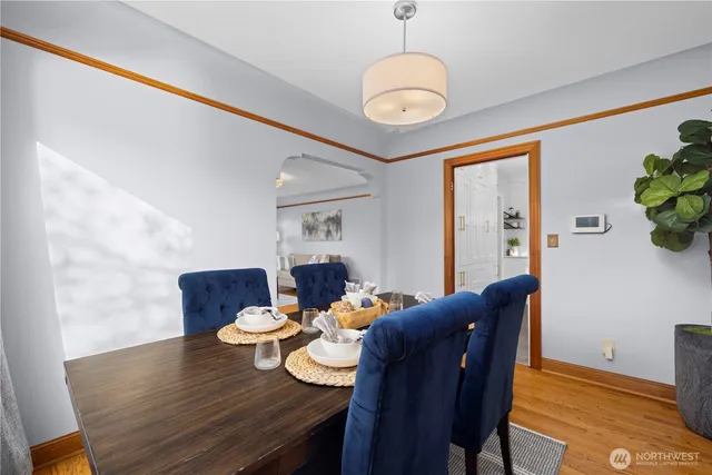 a view of a dining room with furniture window and wooden floor