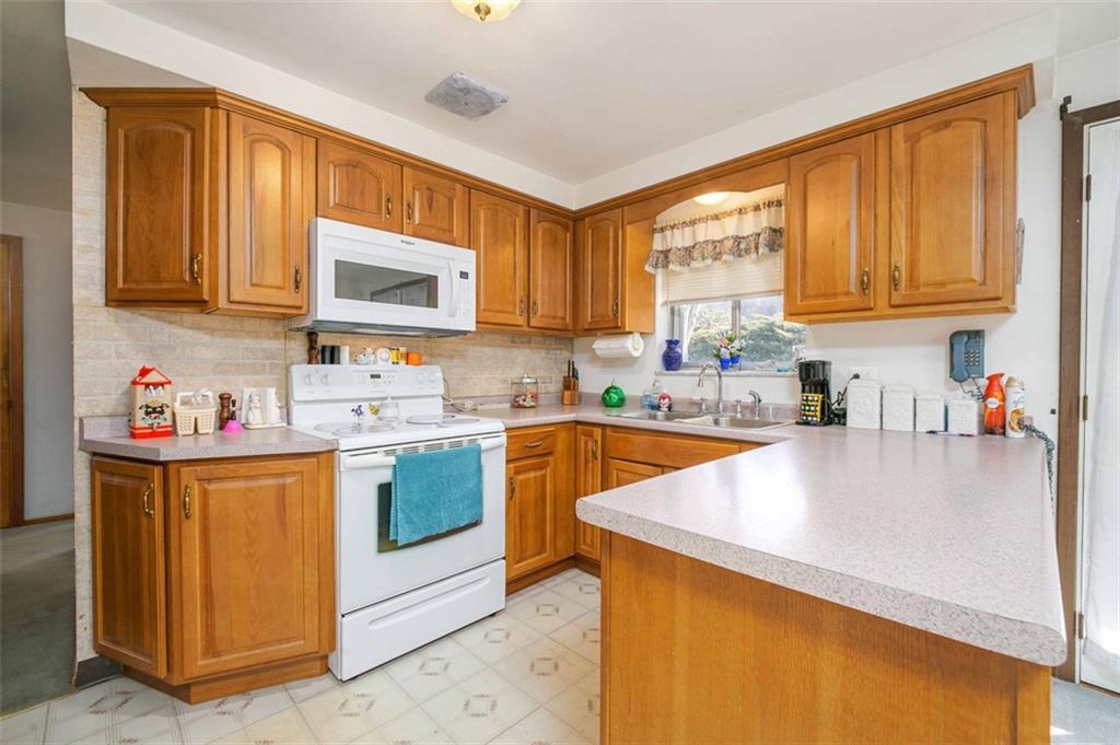 5581 Edwards Road Murrysville, PA 15668 - Photo 15 of 25 Updated full equipped kitchen open to the dining room.