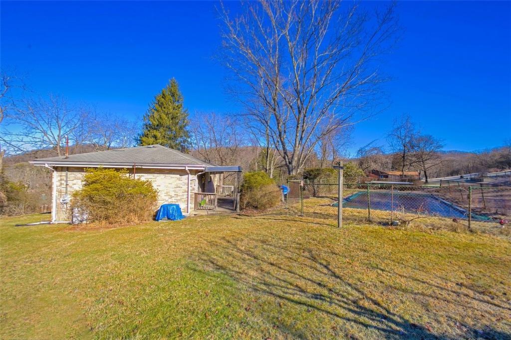 5581 Edwards Road Murrysville, PA 15668 - Photo 7 of 25 View of the side yard and pool.
