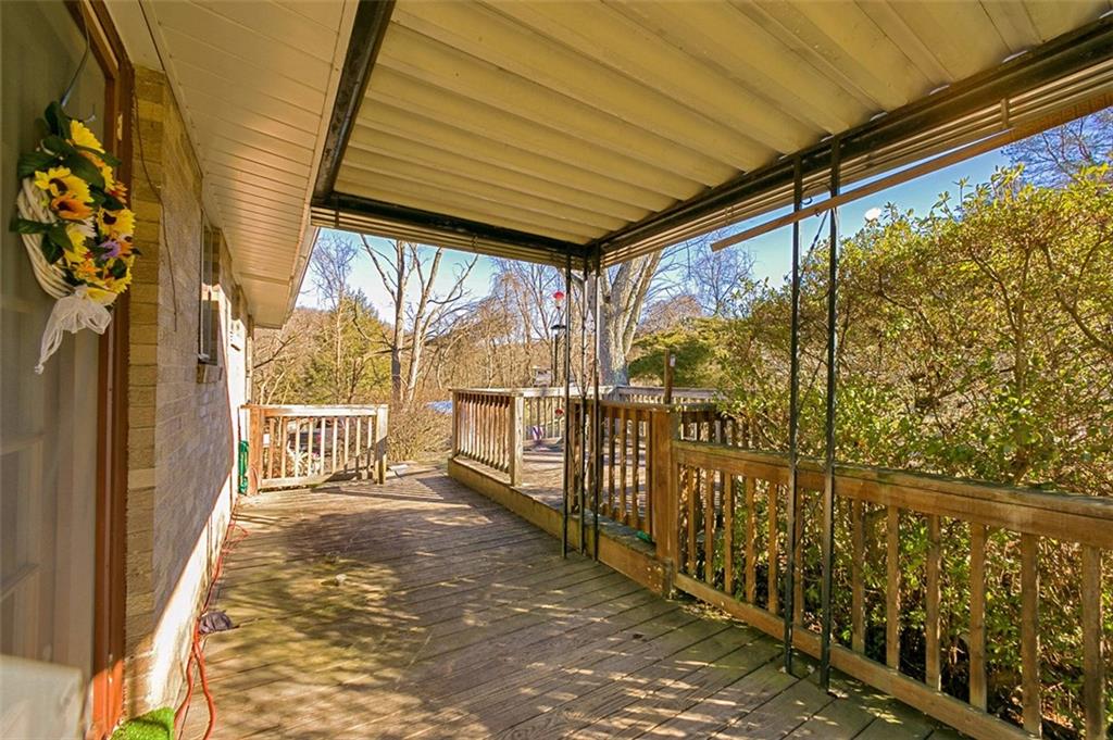 5581 Edwards Road Murrysville, PA 15668 - Photo 8 of 25 Relax on the covered rear deck overlooking the backyard!