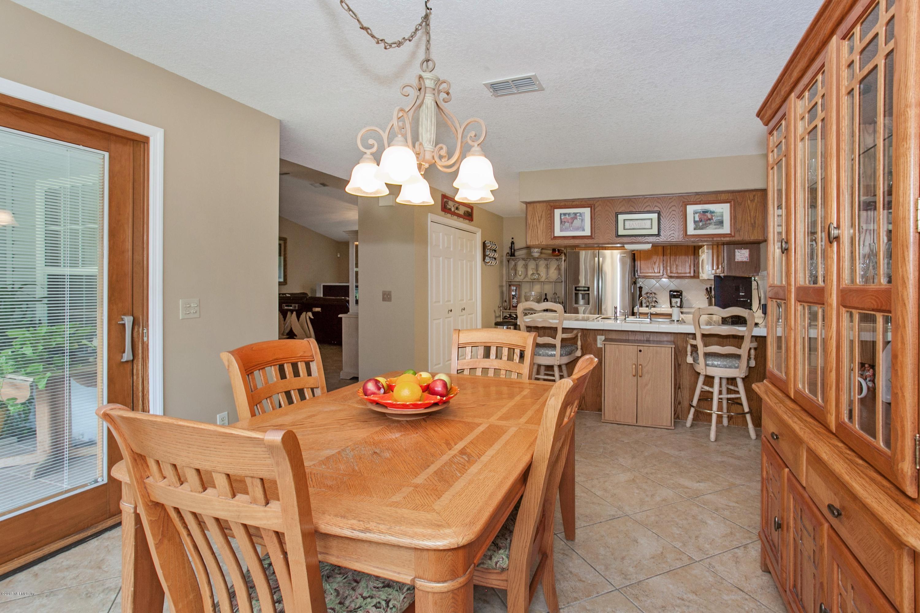 4735 Wolfe Road St. Augustine, FL 32092 - Photo 15 of 39 a view of a dining room with furniture window and outside view