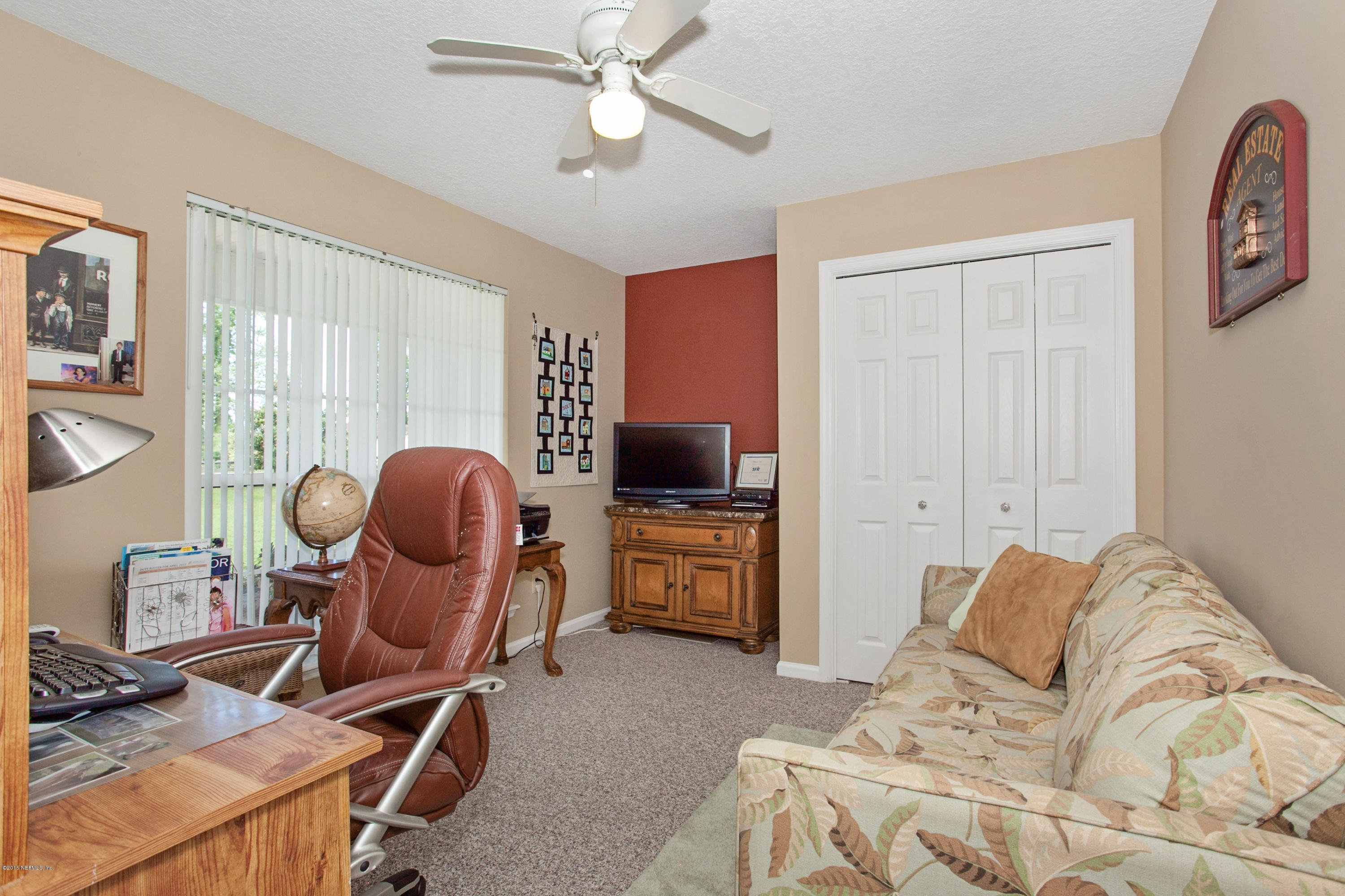 4735 Wolfe Road St. Augustine, FL 32092 - Photo 23 of 39 a bedroom with furniture and a window