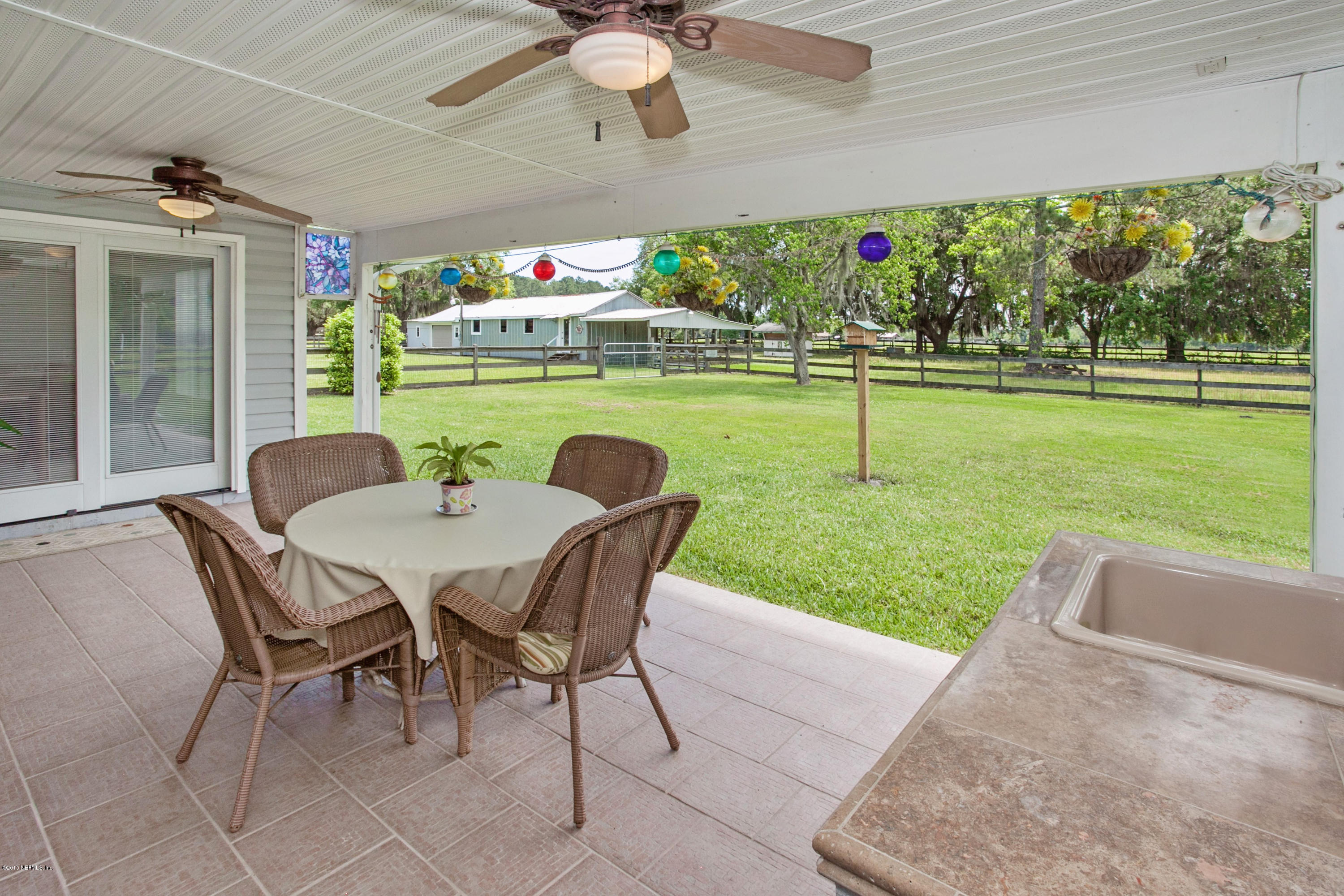 4735 Wolfe Road St. Augustine, FL 32092 - Photo 25 of 39 a view of a patio with a yard