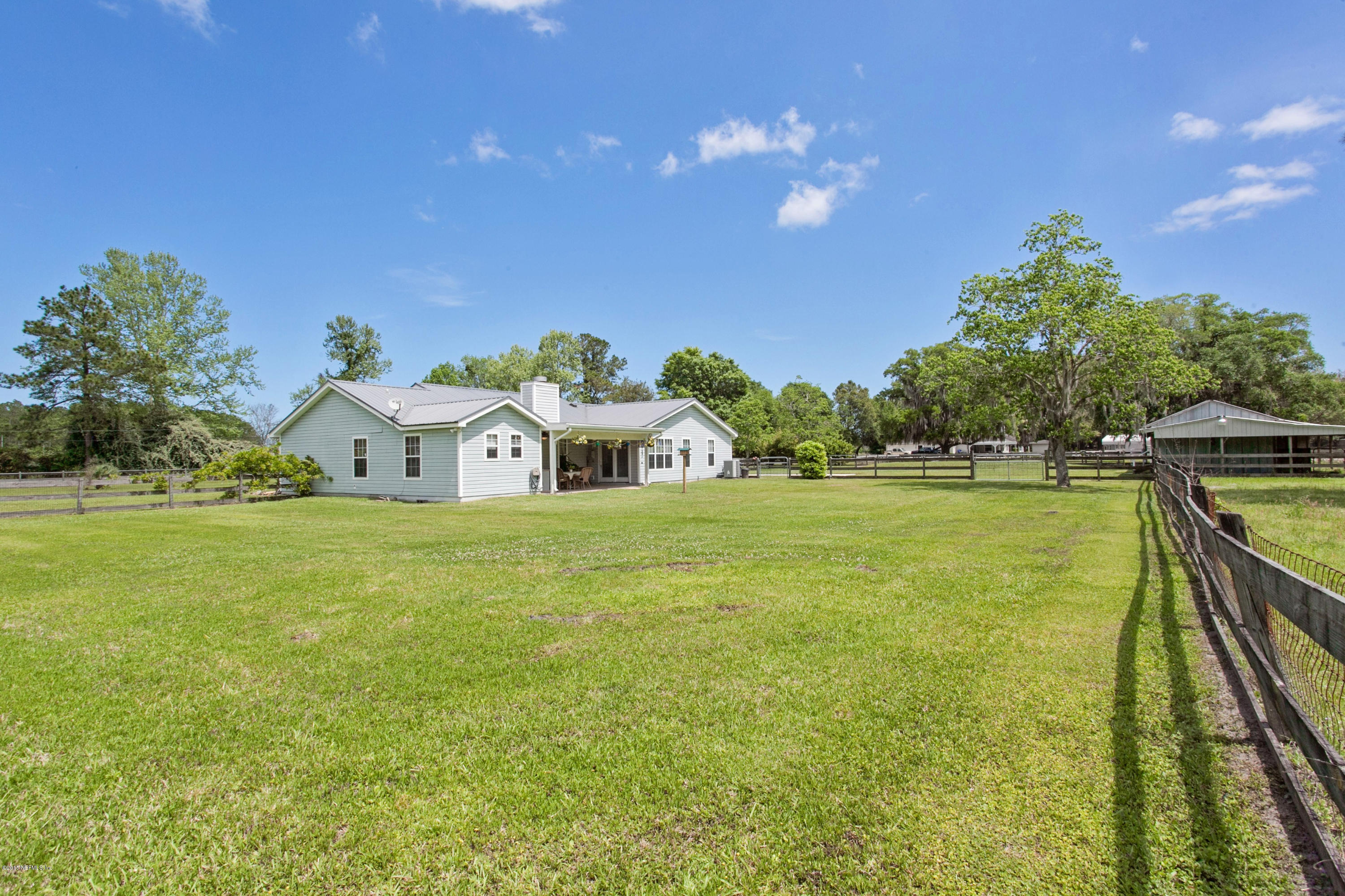 4735 Wolfe Road St. Augustine, FL 32092 - Photo 27 of 39 a view of a house with a big yard