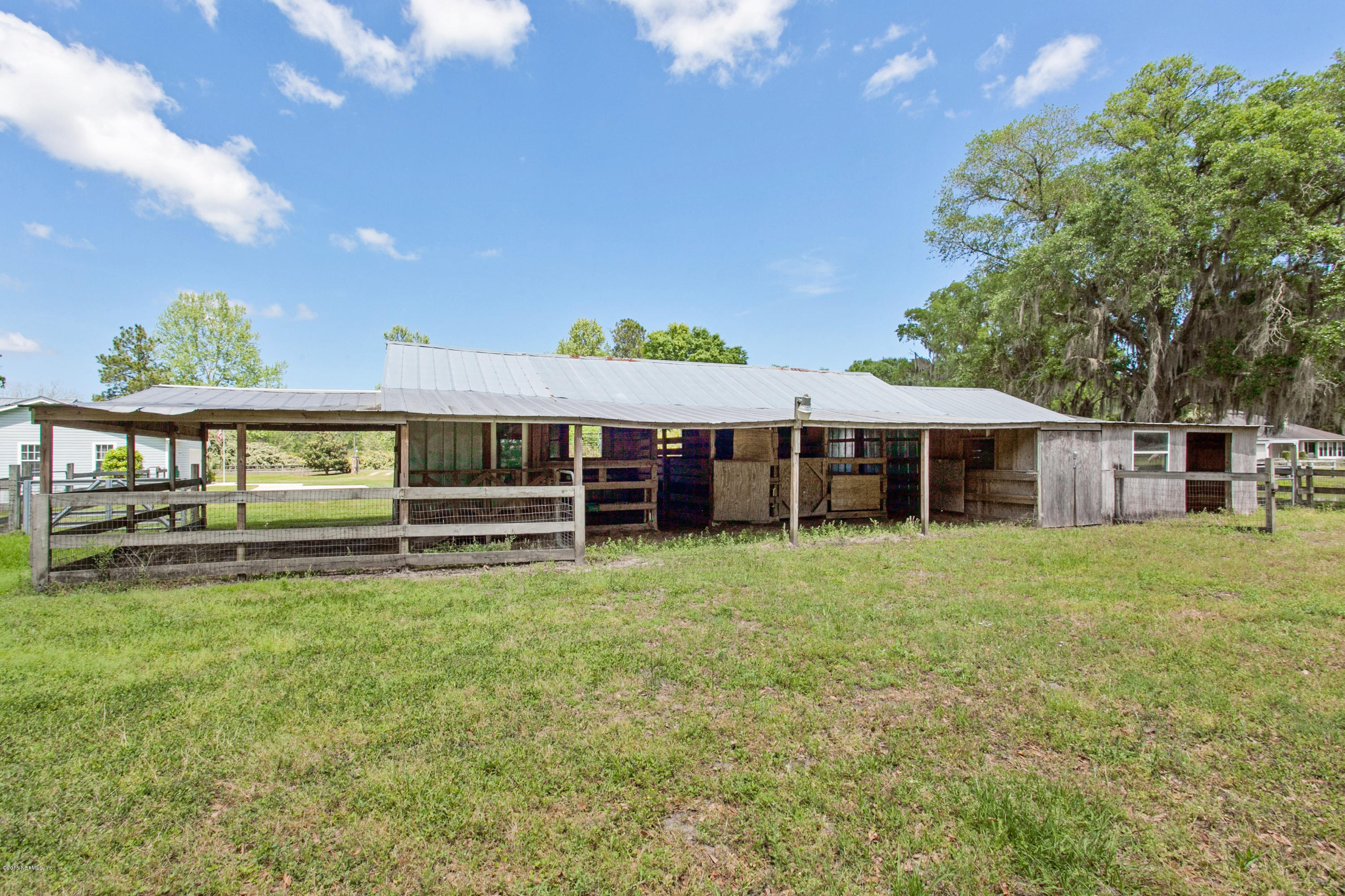 4735 Wolfe Road St. Augustine, FL 32092 - Photo 30 of 39 a view of a house with a yard