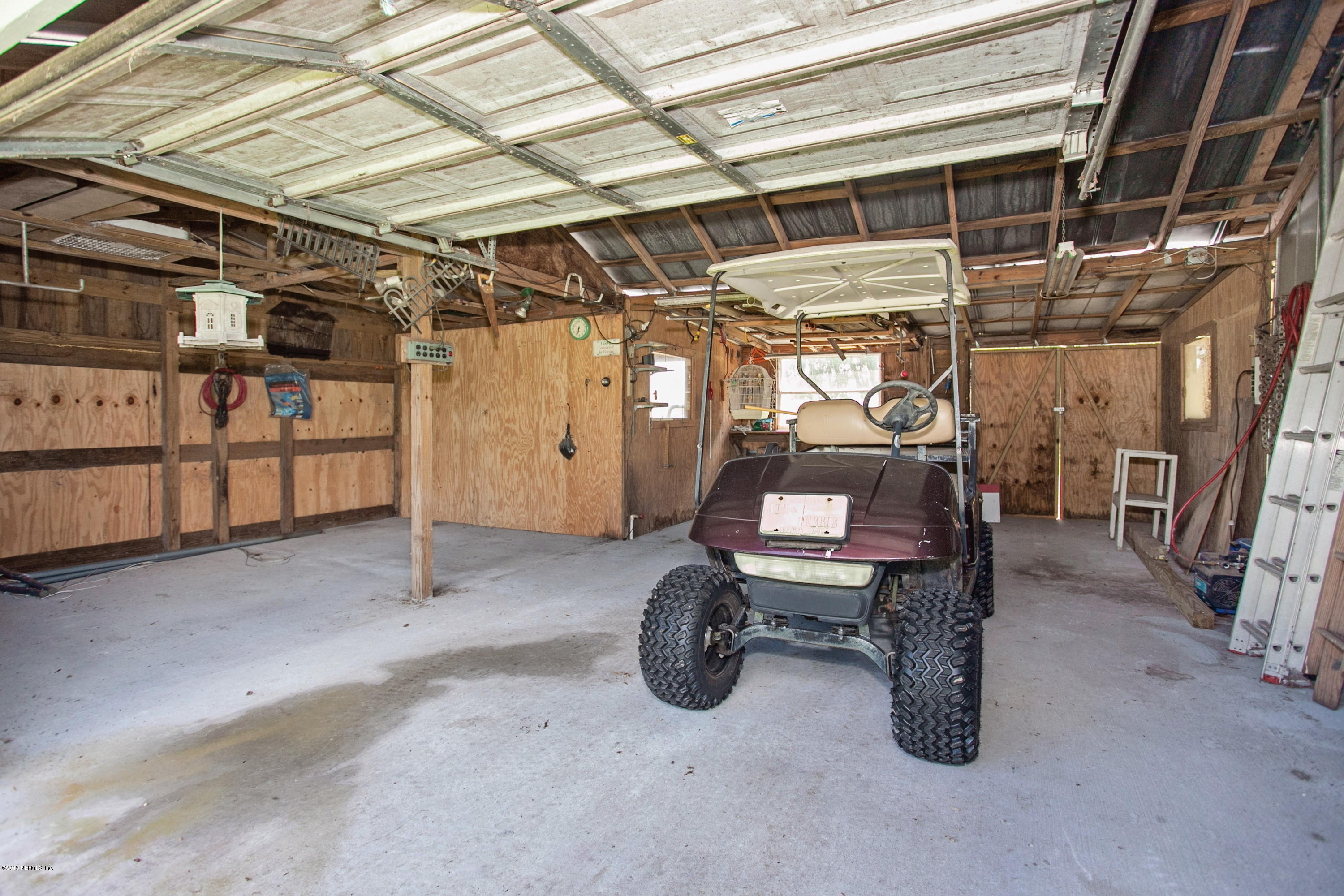 4735 Wolfe Road St. Augustine, FL 32092 - Photo 32 of 39 a view of a storage room with stairs