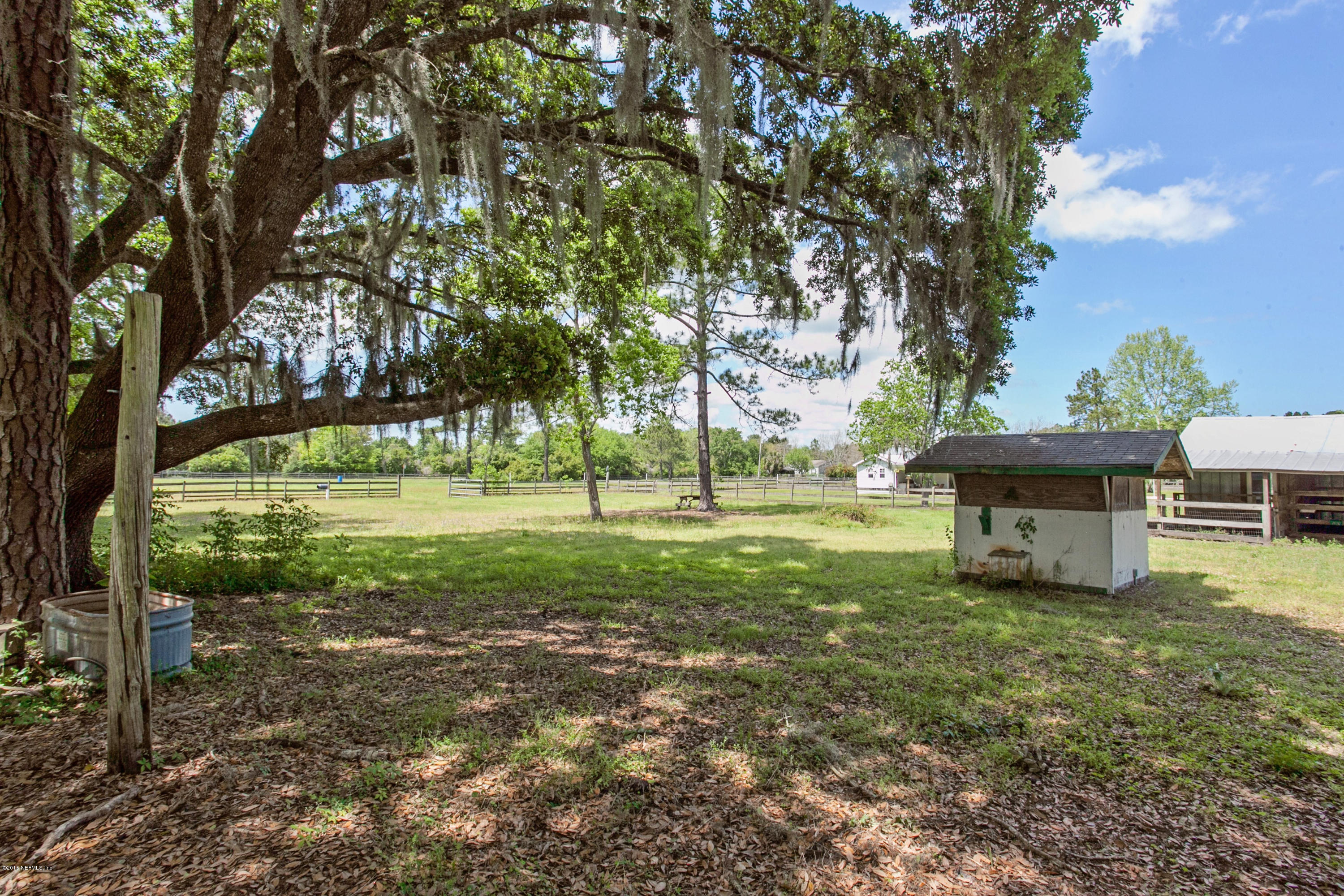 4735 Wolfe Road St. Augustine, FL 32092 - Photo 33 of 39 a view of a house with a yard