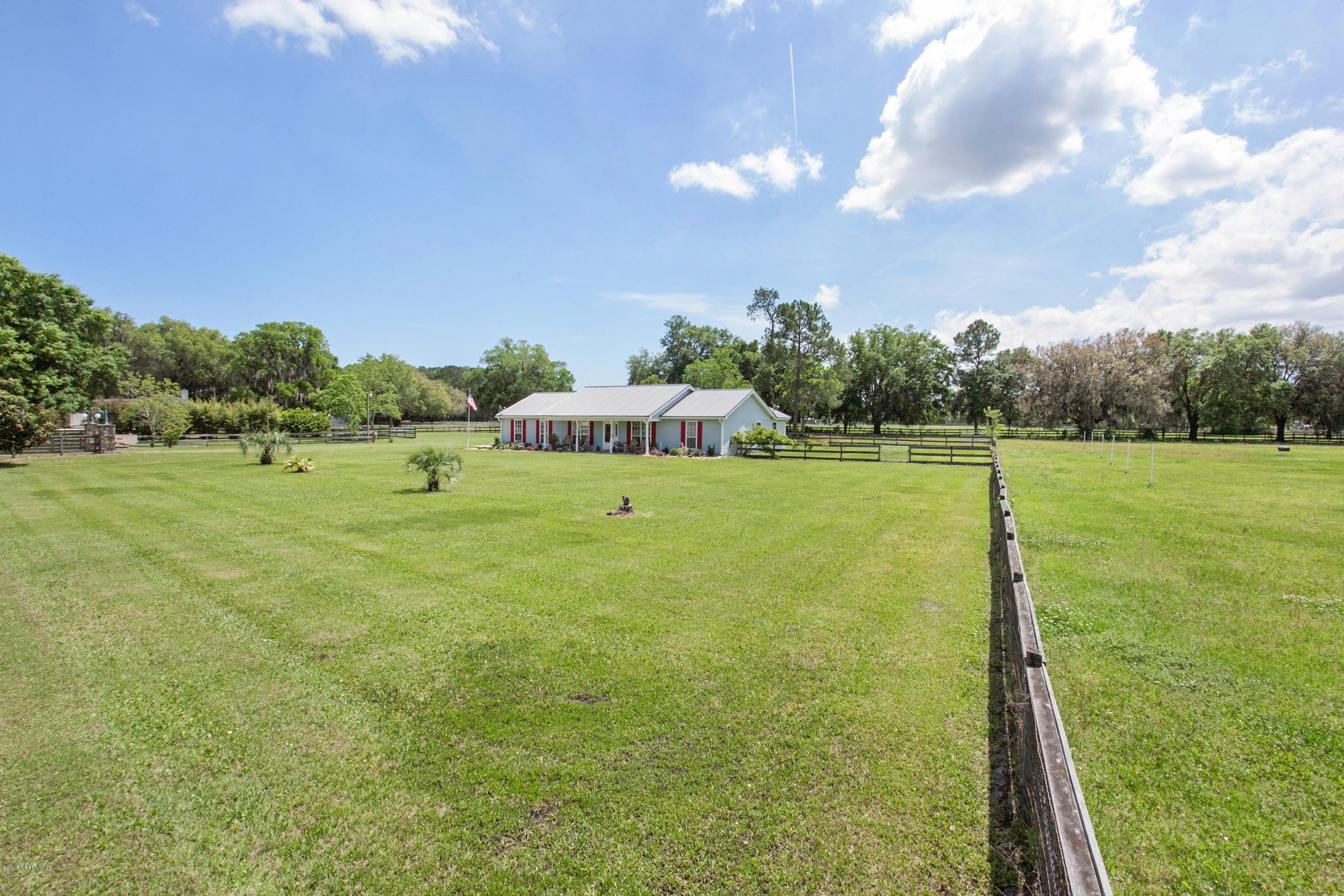 4735 Wolfe Road St. Augustine, FL 32092 - Photo 38 of 39 a view of a green field with clear sky