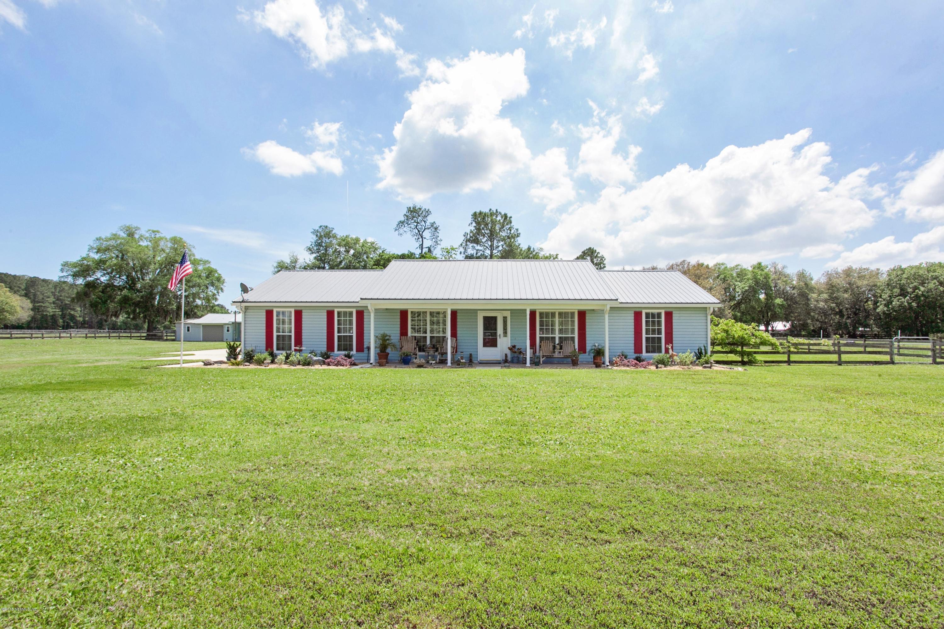 4735 Wolfe Road St. Augustine, FL 32092 - Photo 39 of 39 a front view of a house with garden