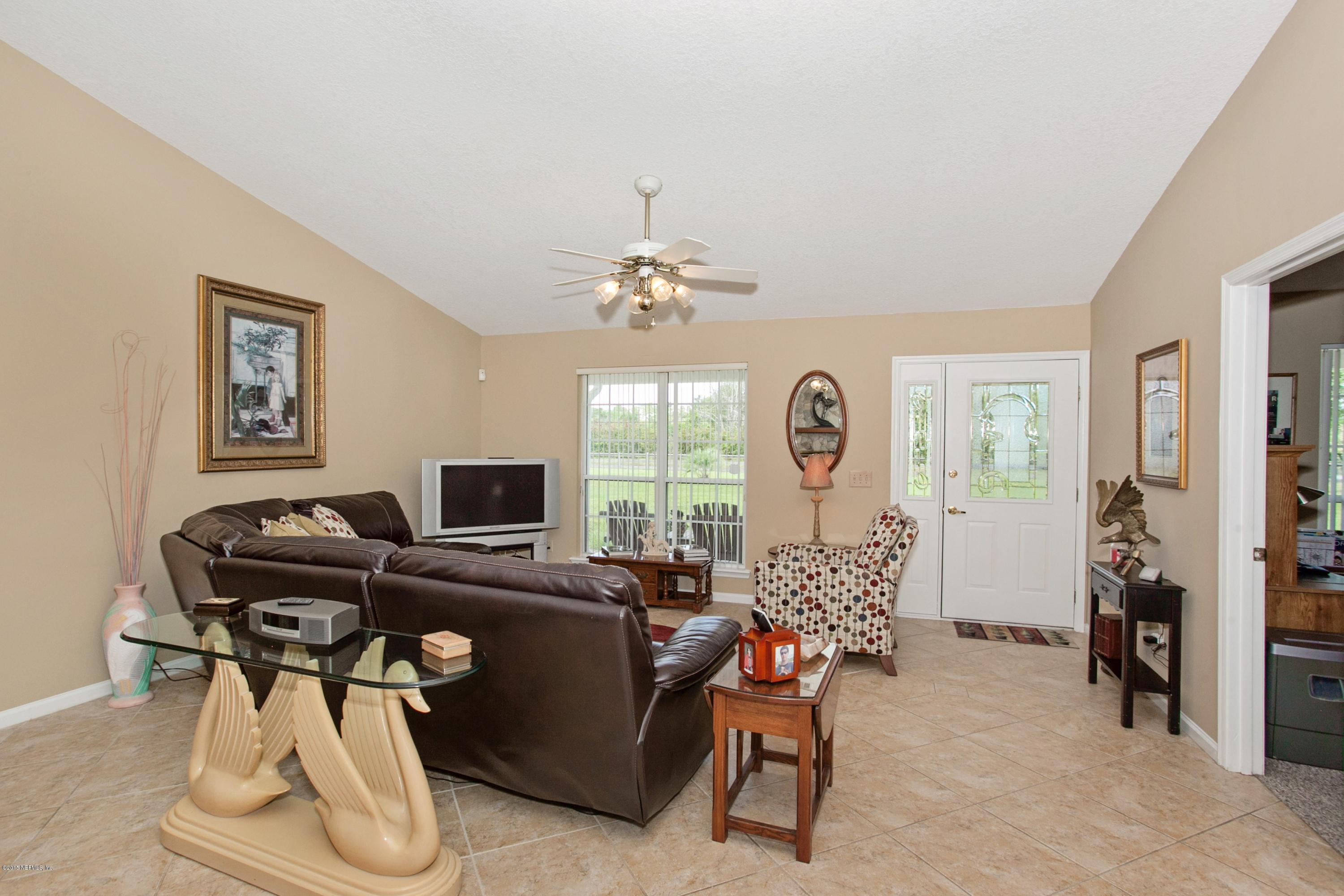4735 Wolfe Road St. Augustine, FL 32092 - Photo 8 of 39 a view of a livingroom with furniture and a window