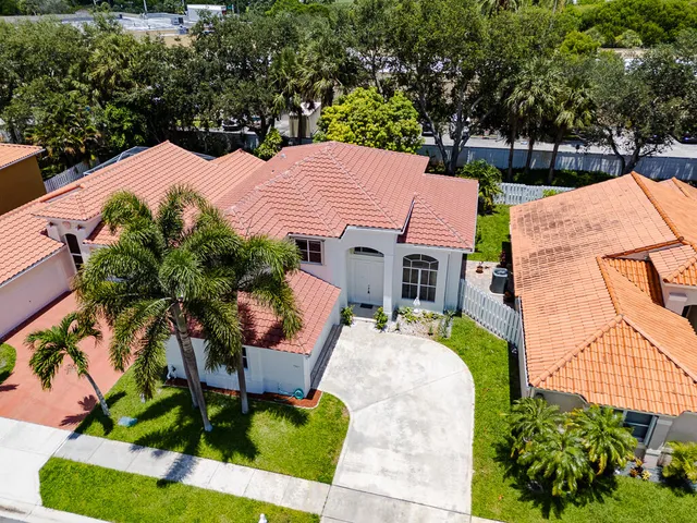an aerial view of residential houses and outdoor space