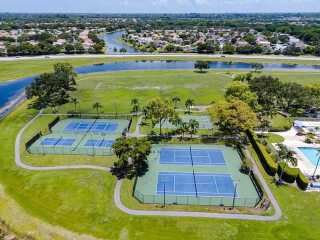 an aerial view of a pool yard and mountain view
