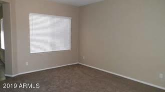 9328 West Berkeley Road Phoenix, AZ 85037 - Photo 3 of 13 an empty room with a window