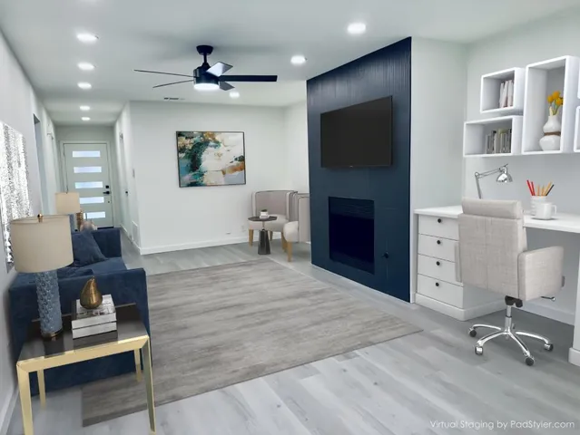 a living room with furniture a fireplace and a flat screen tv