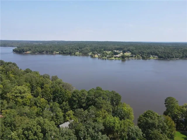 an aerial view of a houses with lake view