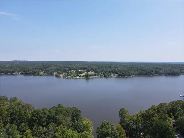 an aerial view of a houses with lake view