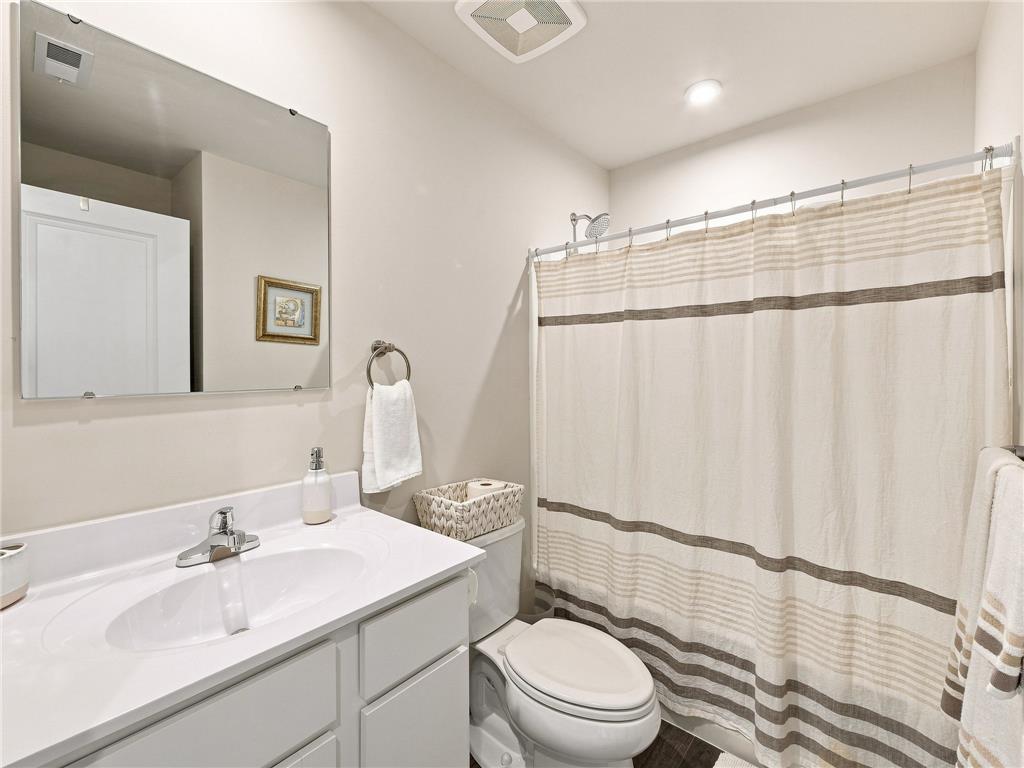 2133 Cross Country Road Northampton, PA 18067 - Photo 41 of 44 A well-appointed bathroom features a white vanity, integrated sink, and recessed lighting.