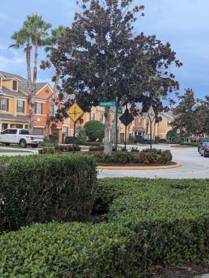 a view of street with houses and trees
