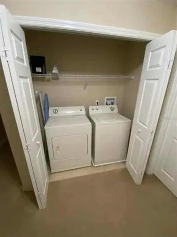 889 Assembly Court Reunion, FL 34747 - Photo 11 of 19 a utility room with dryer and washer