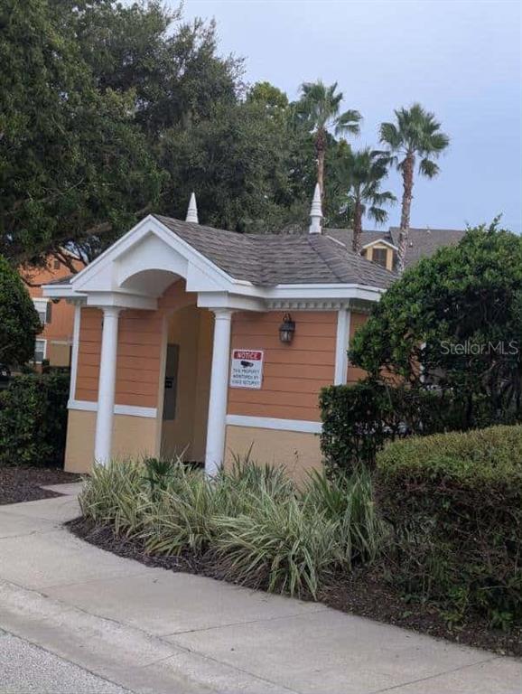 889 Assembly Court Reunion, FL 34747 - Photo 14 of 19 a front view of a house with a yard and garage
