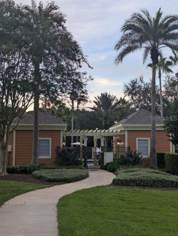 889 Assembly Court Reunion, FL 34747 - Photo 16 of 19 a front view of a house with garden