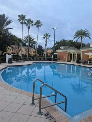 a view of a swimming pool with a lounge chair