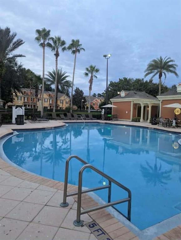 889 Assembly Court Reunion, FL 34747 - Photo 2 of 19 a view of a swimming pool with a lounge chair