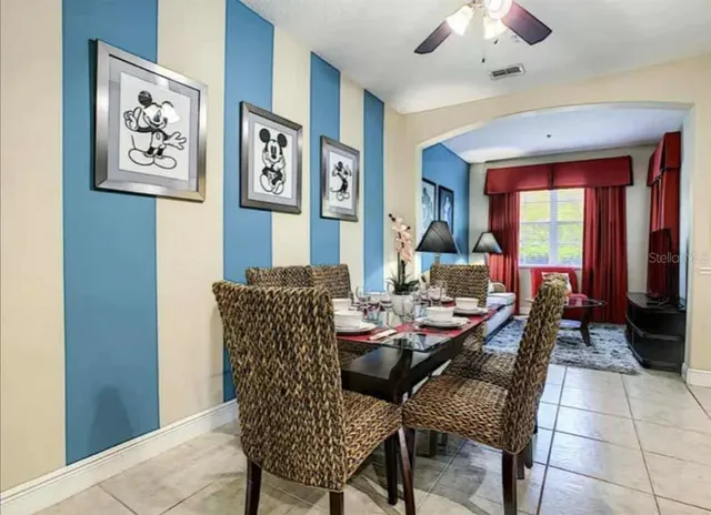 a dining room with furniture and window