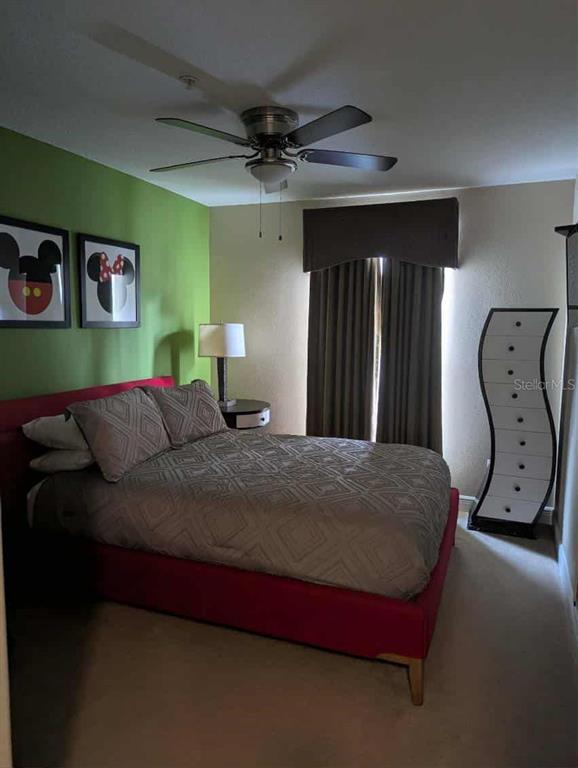 889 Assembly Court Reunion, FL 34747 - Photo 7 of 19 a bed sitting in a bedroom next to a window