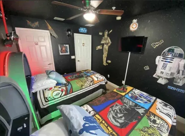 a bedroom with furniture and a wooden floor