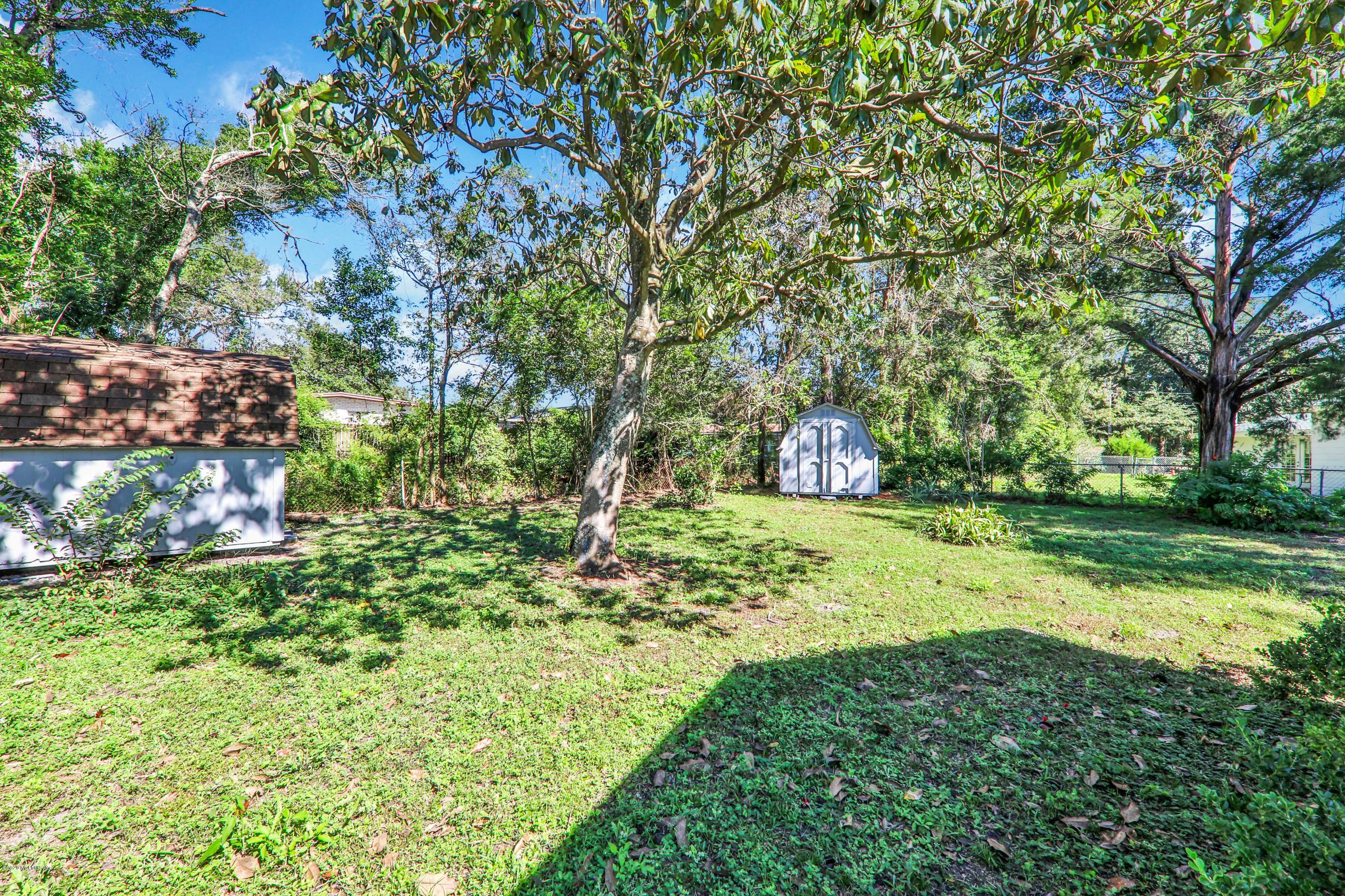 7019 Melvin Road Jacksonville, FL 32210 - Photo 18 of 22 a view of yard with green space