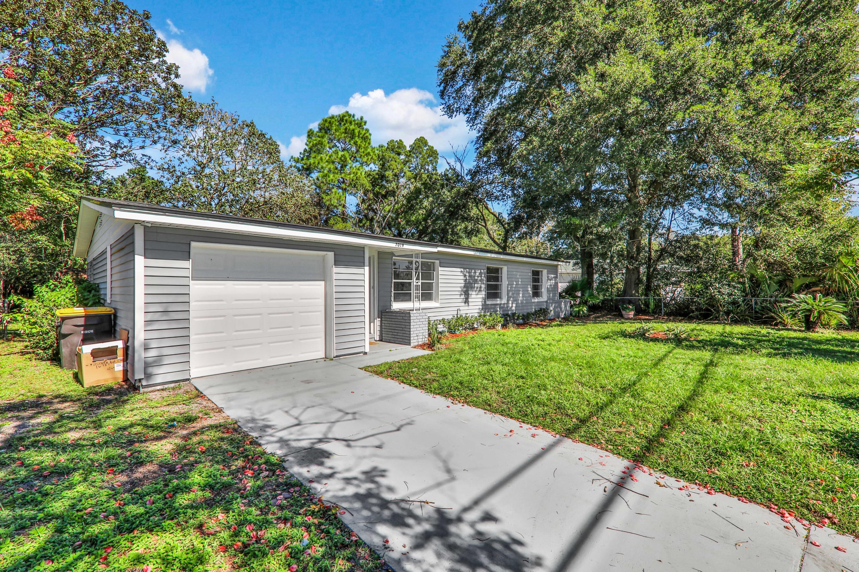 7019 Melvin Road Jacksonville, FL 32210 - Photo 2 of 22 a view of a house with yard and a garden