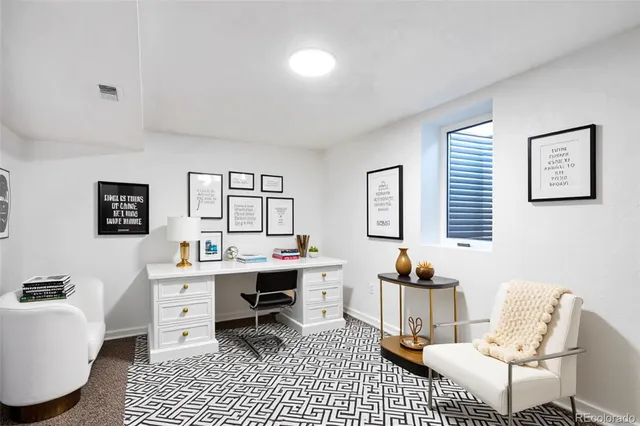 a workspace with furniture and window