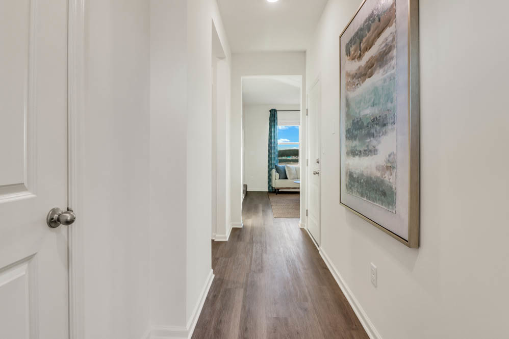 501 Conover Drive Joliet, IL 60421 - Photo 2 of 21 a view of a hallway with wooden floor and a bathroom