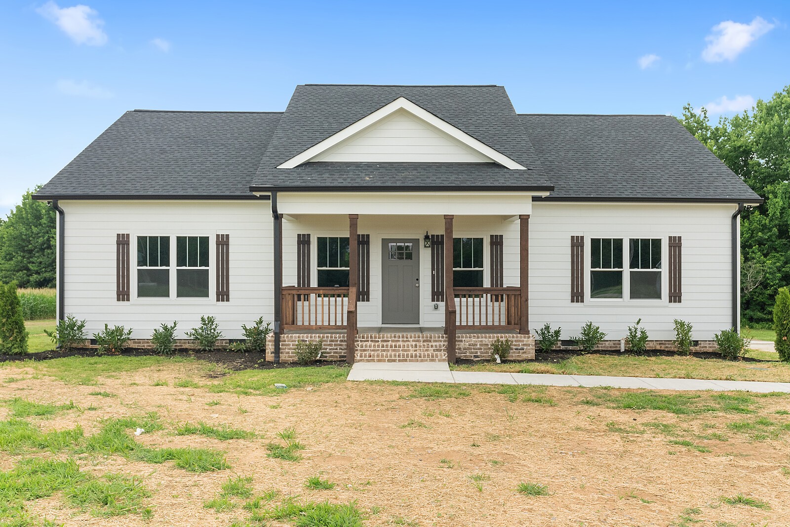 a front view of a house with a yard